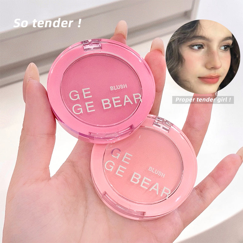 Pink blush compact with 'GE GE BEAR' branding held in a hand, with a close-up of a person wearing the blush.