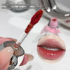 Lip gloss applicator with red texture and close-up of lips wearing the product.