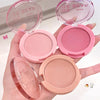 Hand holding three pink makeup compacts with 'Bebe' branding.