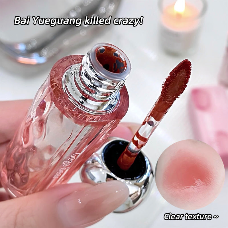 Lip gloss with applicator and close-up of lip texture, text 'Bai Yueguang killed crazy!' and 'Clear texture ~' on a blurred background.