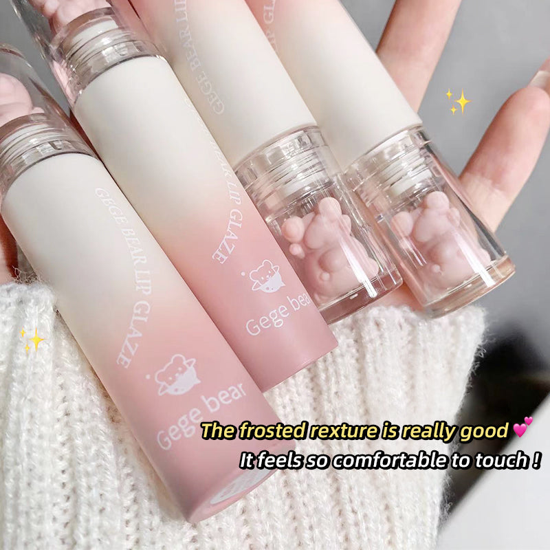 Set of Gege bear lip balms with a textured finish held by hands on a white background.