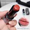 Lipstick held by a hand with an inset of lips wearing the lipstick color.