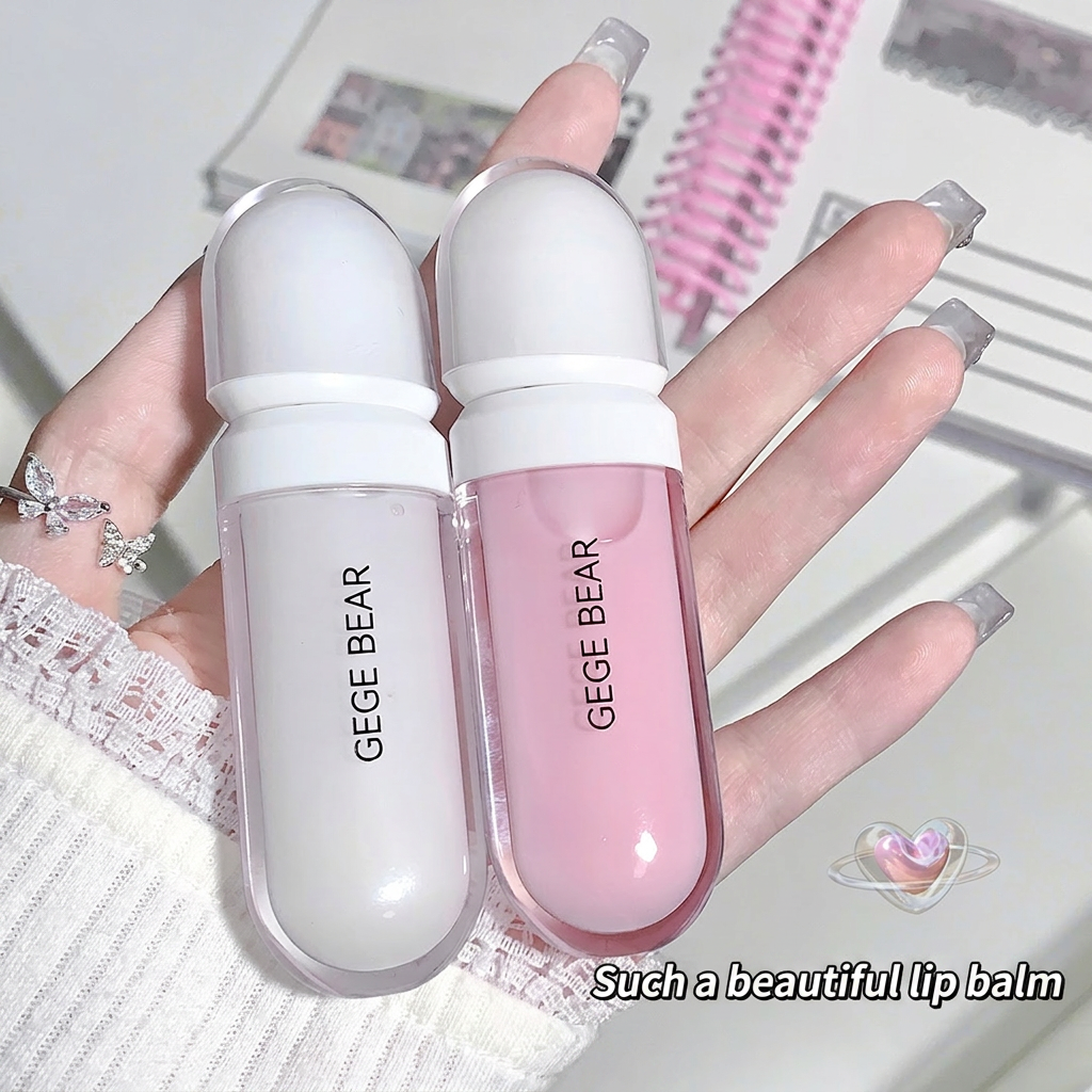 Two lip balms, one white and one pink, held in a hand with a blurred background.