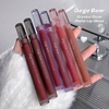 Set of Gege Bear Crystal Clear Moist Lip Glaze lip glosses held by a hand.