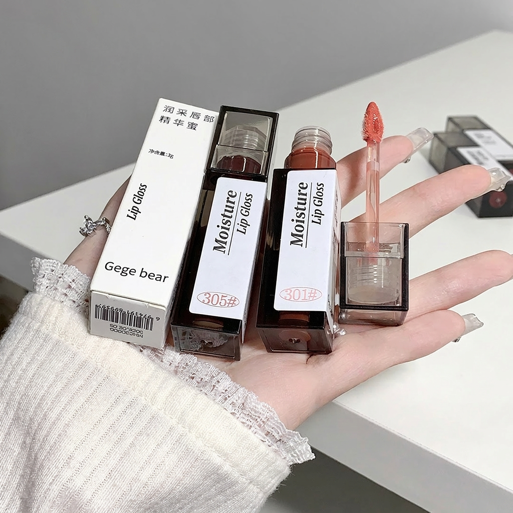 Moisture lip gloss with applicator held by a hand, set against a neutral background.