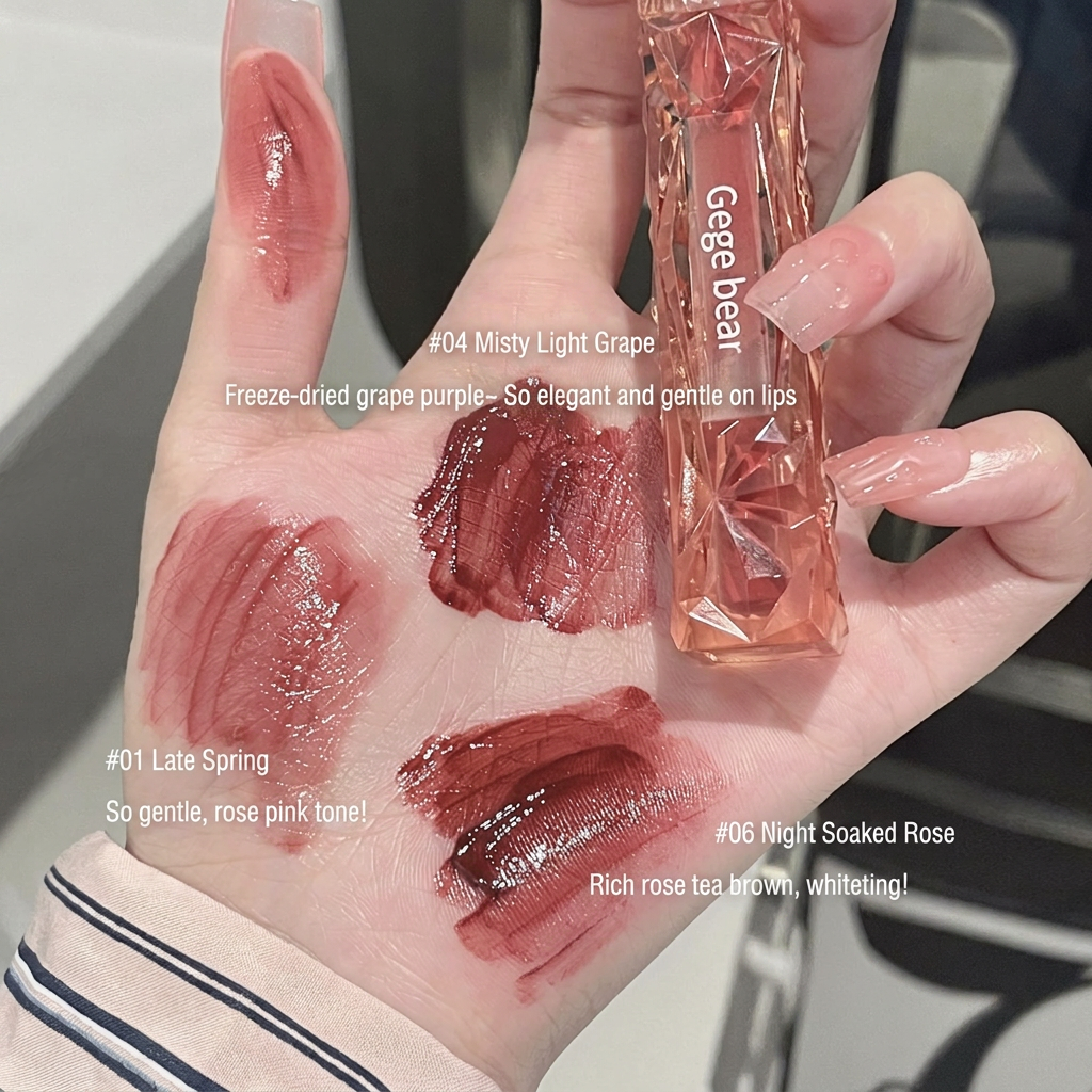Hand with lipstick swatches and a lip gloss tube labeled 'Geege Bear' on a blurred background