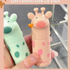 Two colorful lip glosses with animal designs held by a hand, labeled 'GEGE BEAR'.
